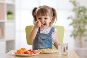 Child eating moringa marinara pasta