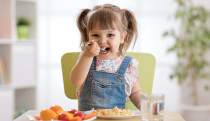 Child eating moringa marinara pasta