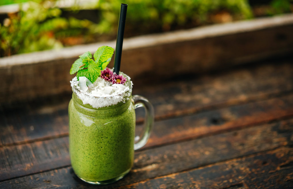 Moringa Smoothie with coconut flakes and mint